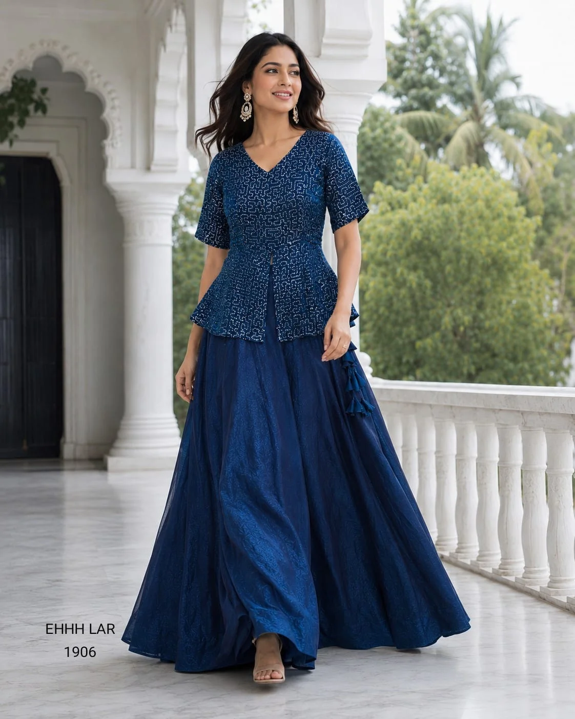 Georgette Sequins Embroidered Peplum Top with Shimmer Organza Lehenga.